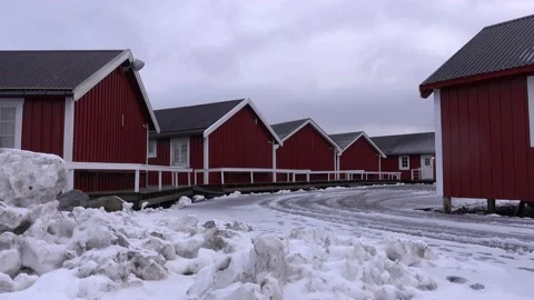 Typical charming village of snowy red cabins in Lofoten, Norway Video stock 146237236