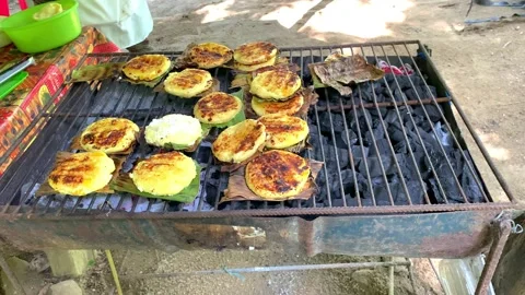 Toasting a Colombian Arepa on a Grill Stock Image - Image of