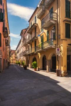 Typical colorful building on narrow cobblestone street in Mondovi, Cuneo Stock Photos