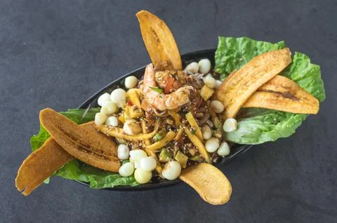 Typical dish of Mexican and Peruvian cuisine. Eviction with fried banana Stock Photos