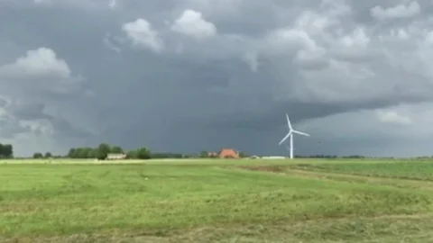 Typical dutch landscape before rain with windmill Stock Footage 104253573
