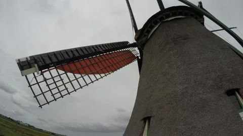 Typical Dutch tatch windmill view close to wooden blades mill rotating 4k Stock Footage 53452087