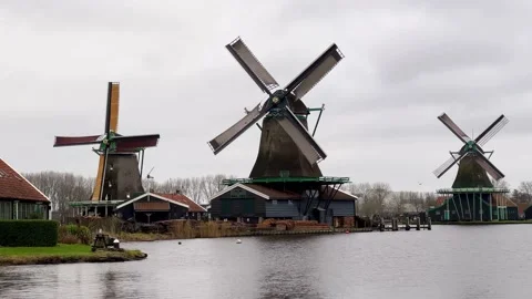 Typical Dutch Windmills of Zaanse Schans spinning in the wind. Video stock 168225559
