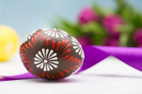 Typical easter egg and tulips Stock Photos