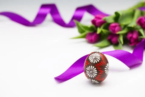 Typical easter egg and tulips Stock Photos