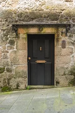 Typical facade with old door. An old house in the neighborhood of Ponte de .. Stock Photos