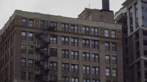 Typical generic day time establishing shot of an urban apartment building fac Stock Photos