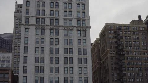 Typical generic day time establishing shot of an urban apartment building fac Stock Photos