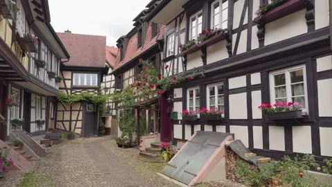 Typical half-timbered houses lined along a pedestrian street in Gengenbach Stock Footage 289000358