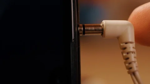Typical headphone connection. Extreme close-up recorded with a macro lens. Video stock 120532193