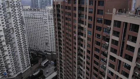 Typical high-rise apartment tower at Shanghai city, camera fly down along facade Stock Footage 101124155