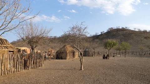 Typical Himba village, Kaokoland, Namibia, Africa in 4K, little huts Stock Footage 90878513