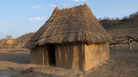 Typical Himba village, Kaokoland, Namibia, Africa in 4K, little hut Stock Footage 90879293