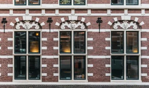 Typical holland stylish house facade made with red bricks Stock Photos