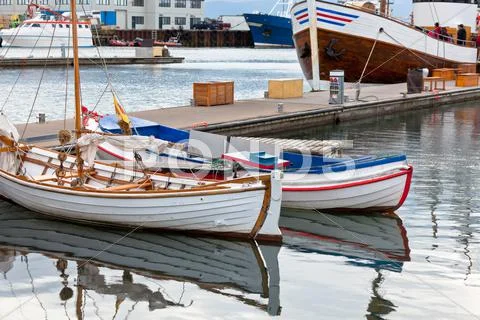 Typical iceland harbor with fishing boats Stock Photos