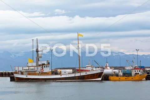 Typical iceland harbor with fishing boats Stock Photos