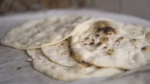 Typical Indian bread cake called chapatis in a bakery, in Bahrain Stock Footage 244953376