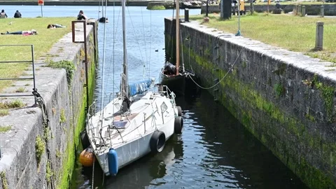 Typical Irish landscape with river and moored boat Stock Footage 278887905