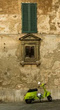 Typical Italian scene of scooter in front of building Stock Photos
