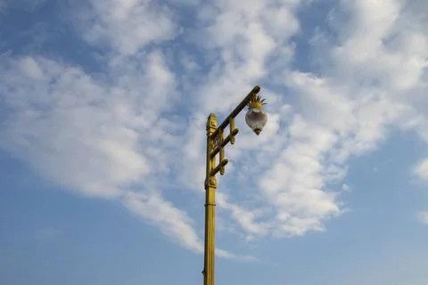 A typical  lamppost on a blue sky background. Stock Photos