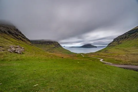 Typical landscape of Faroe islands with cloudy sky Stock Photos