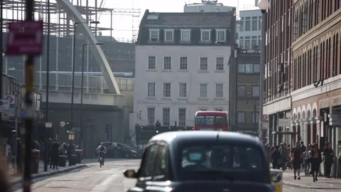Typical London: red bus approaching (sunny weather) Stock Footage 75608445