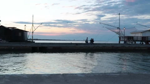Typical marine construction in the sunset with people Video stock 132048973