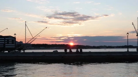 Typical marine construction in the sunset with people Video stock 132048990