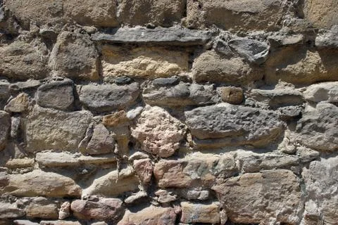 Typical mediterranean stone wall texture Stock Photos