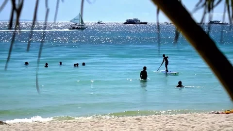 Typical midday scene at Boracay beach, in the Philippines, featuring bathers Vídeos de archivo 345121870