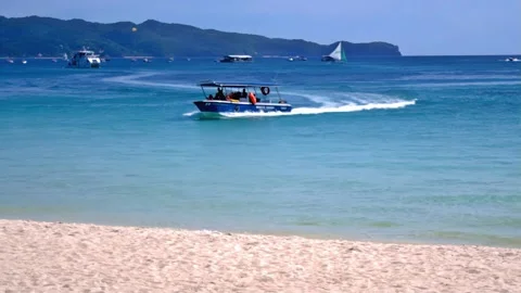 Typical midday scene at Boracay beach, Philippines, featuring bathers and Stock Footage 345173931