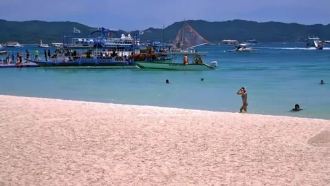 Typical midday scene at Boracay beach, Philippines, featuring varied Stock Footage 345176749