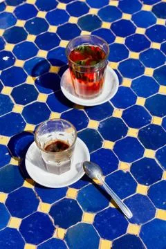A typical Moroccan mint tea in a small outdoor cafe Stock Photos