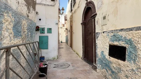 A typical narrow, empty street in the ancient Medina of Fes 動画素材 339498509