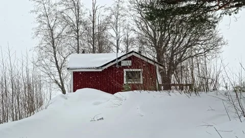 Typical Nordic house in Lulea while it snows, Swedish Lapland. Stock Footage 236259423