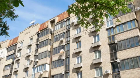 Typical old building and a blooming chestnut tree in Kyiv - Editorial, 4K, Tilt Stock Footage 174373997