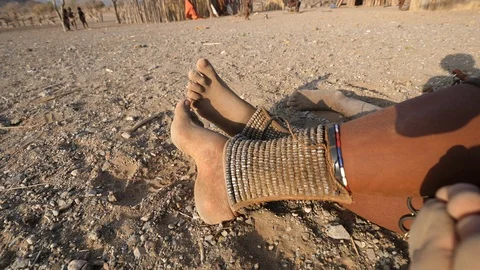 Typical ornaments at the ankle oh an Himba, Opuwo, Namibia Africa in 4K Stock Footage 90879928
