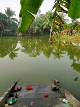 A typical pond with steps leading to it at Joygopalpur in West Bengal, India Stock Photos