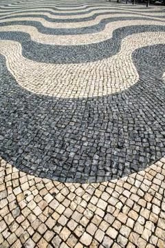 Typical portuguese cobblestone pavement pattern . black and white Stock Photos