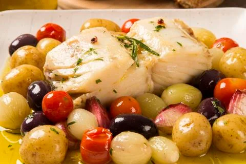 A typical Portuguese dish with codfish called Bacalhau do Porto. Stock Photos