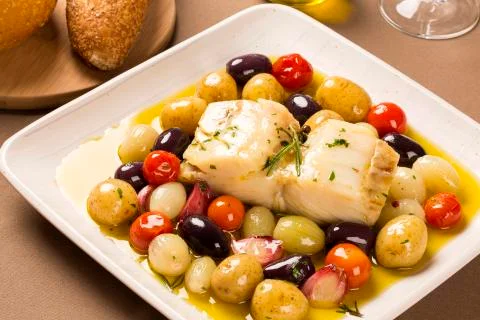 A typical Portuguese dish with codfish called Bacalhau do Porto. Stock Photos