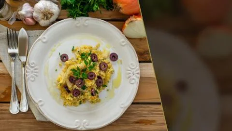 A typical Portuguese dish of shredded cod, with potato straw, mixed egg and b Stock Photos