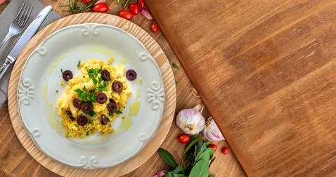 A typical Portuguese dish of shredded cod, with potato straw, mixed egg and d Stock Photos