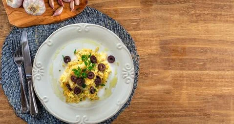 A typical Portuguese dish of shredded cod, with potato straw, mixed egg and d Stock-Fotos