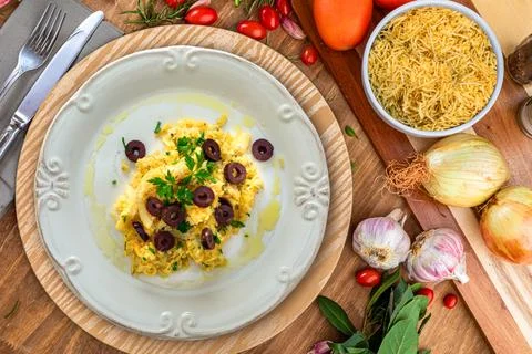A typical Portuguese dish of shredded cod, with potato straw, mixed egg and d Stock Photos