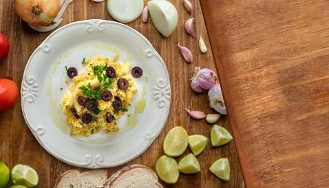 A typical Portuguese dish of shredded cod, with potato straw, mixed egg and d Stock Photos