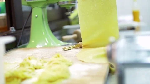 Typical process of making dough for pasta is to use a pasta machine. Working Stock Footage 74718466