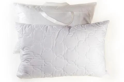 Typical rectangular sleeping pillows, one of them is in bag Stock Photos