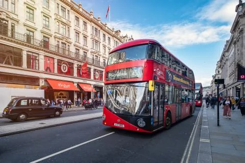 Typical red double decker bus at the famous Regent Street in London Stock Photos