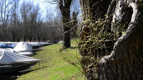 Typical river boats moored and covered with tarpaulins Stock Footage 87345093